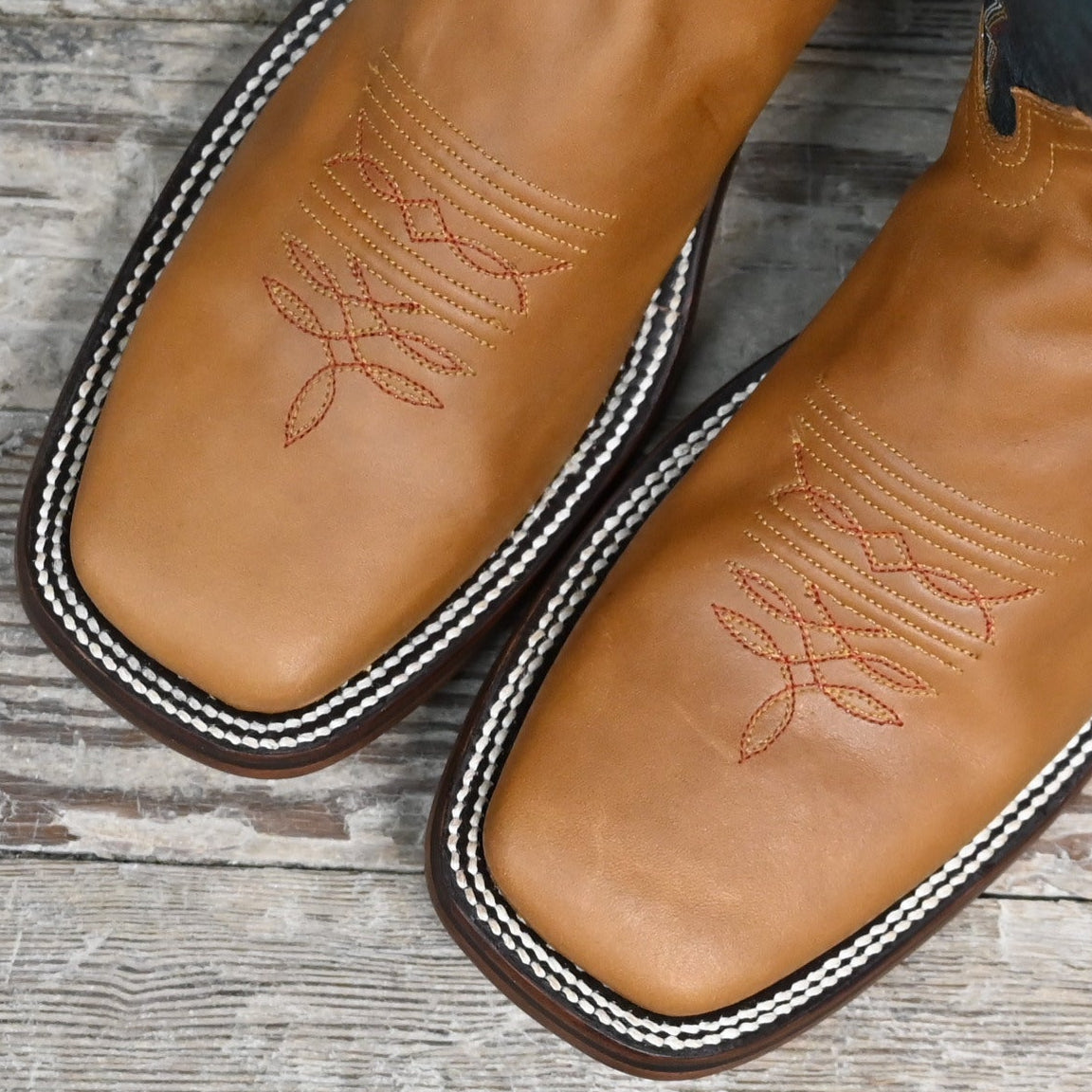 View of Hondo 16&quot; cowboy boot with navy volcano top, honey crazy horse vamp, wide square toe, and pull holes