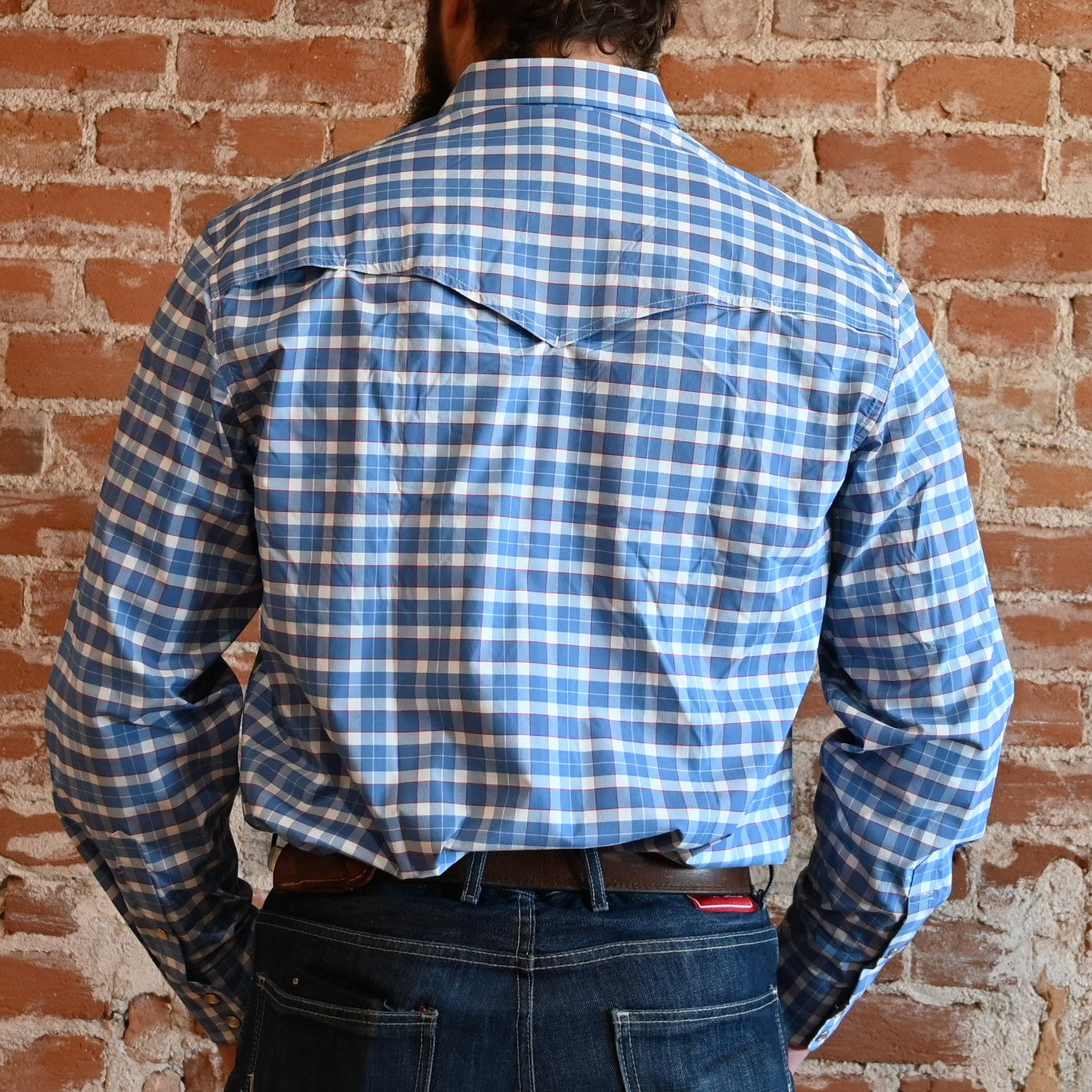 View of Schaefer blue plaid Western snap shirt with mesh-back vent, chest pockets, and yoke detailing