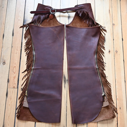 View of K Bar J Cowboy Basic Shotgun Chaps in Size Large with fringe and buckle closures