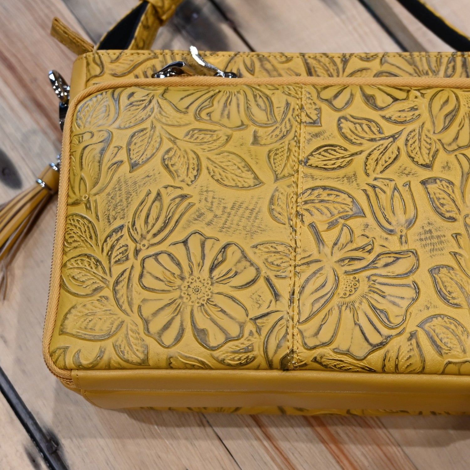 Mustard debossed USA cowhide conceal carry clutch by Gun Toten Mamas with rose leaf pattern and zipper access