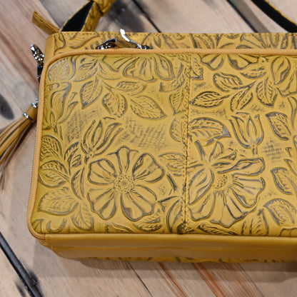 Mustard debossed USA cowhide conceal carry clutch by Gun Toten Mamas with rose leaf pattern and zipper access