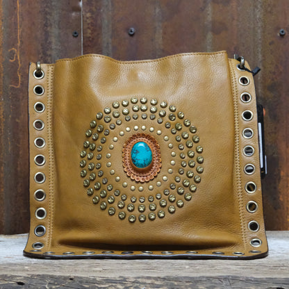 American Darling leather crossbody bag with studded circle and turquoise concho
