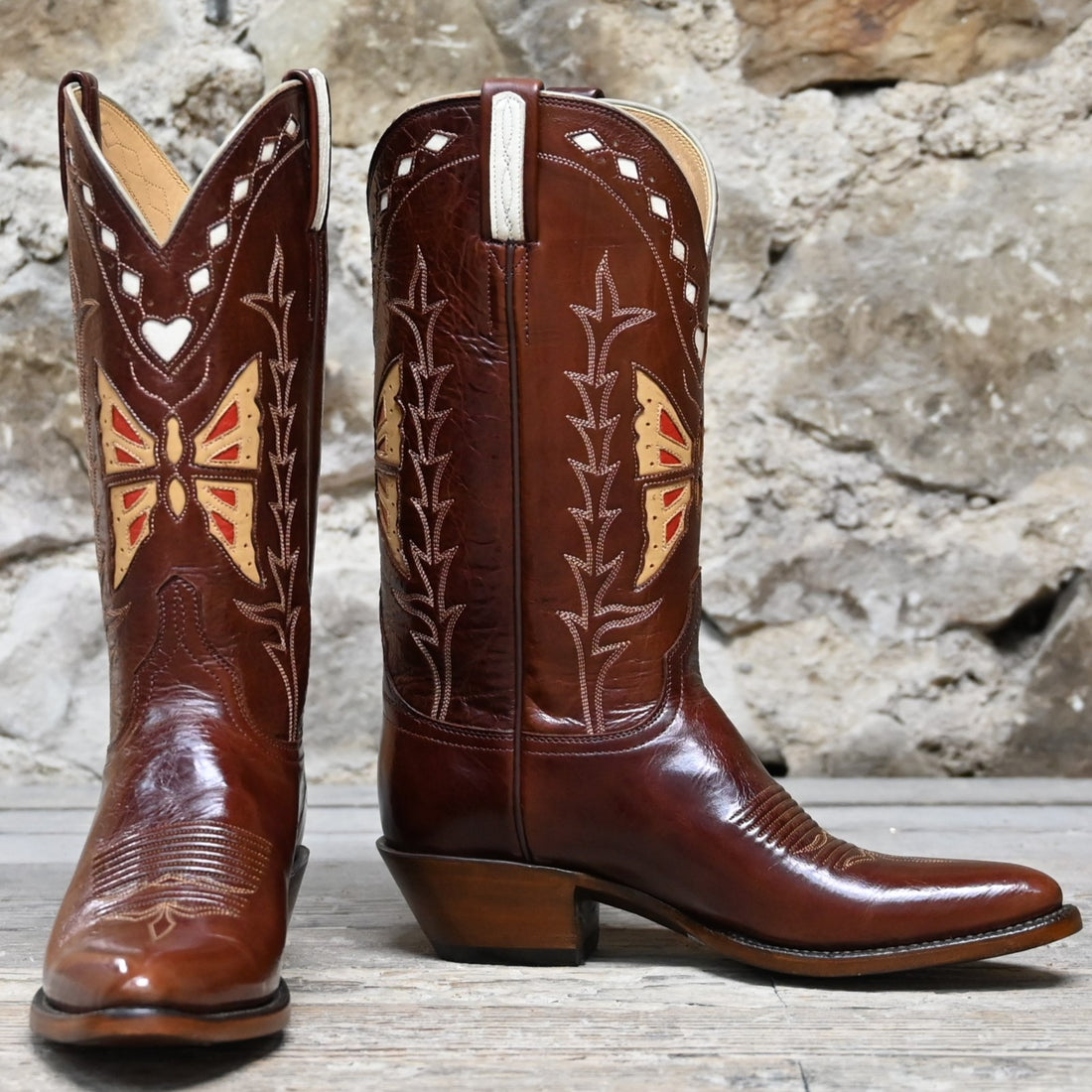 View of Lucchese ladies 12″ whiskey leather boot with butterfly inlay and sharp rounded toe
