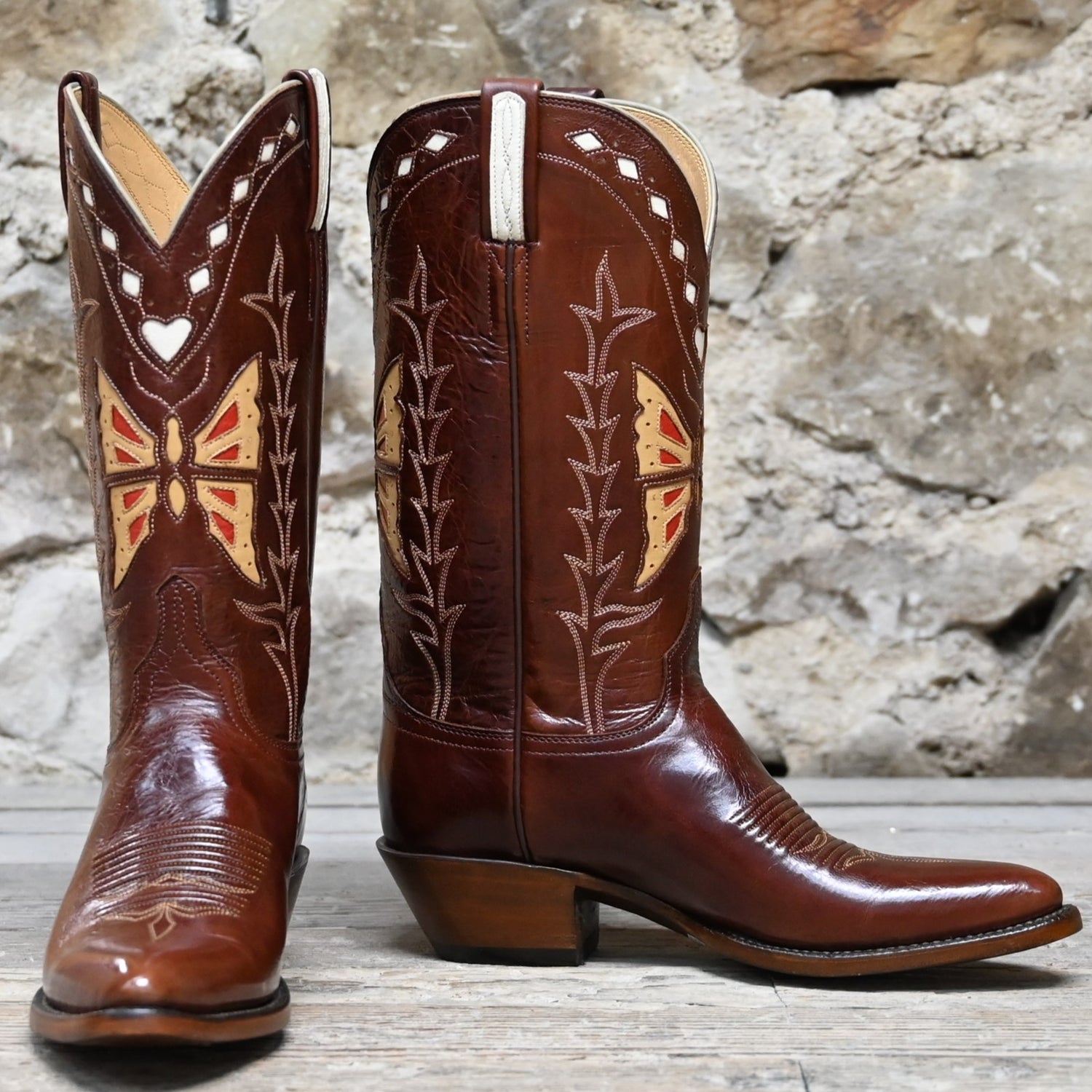 View of Lucchese ladies 12″ whiskey leather boot with butterfly inlay and sharp rounded toe