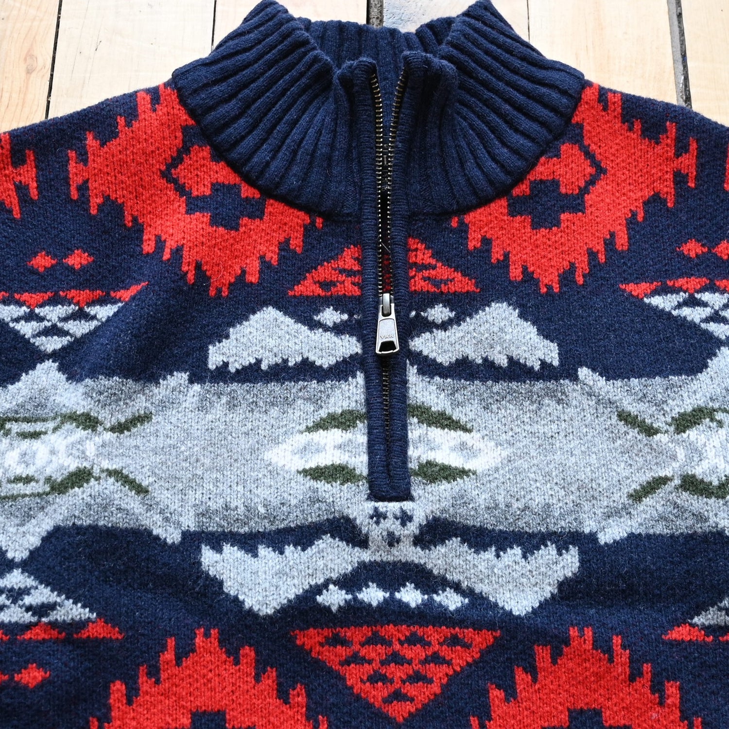 View of Pendleton men’s Nehalem lambswool ¼‑zip sweater in navy and red with geometric pattern