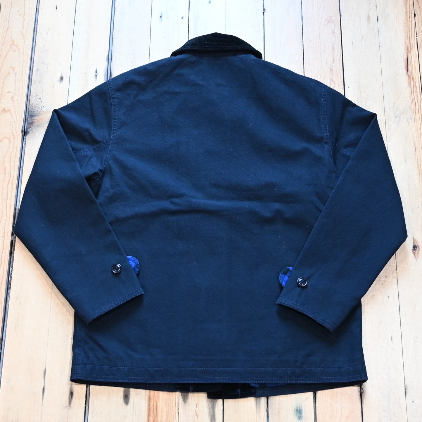 Filson women’s barn coat in navy canvas with corduroy collar and patch pockets