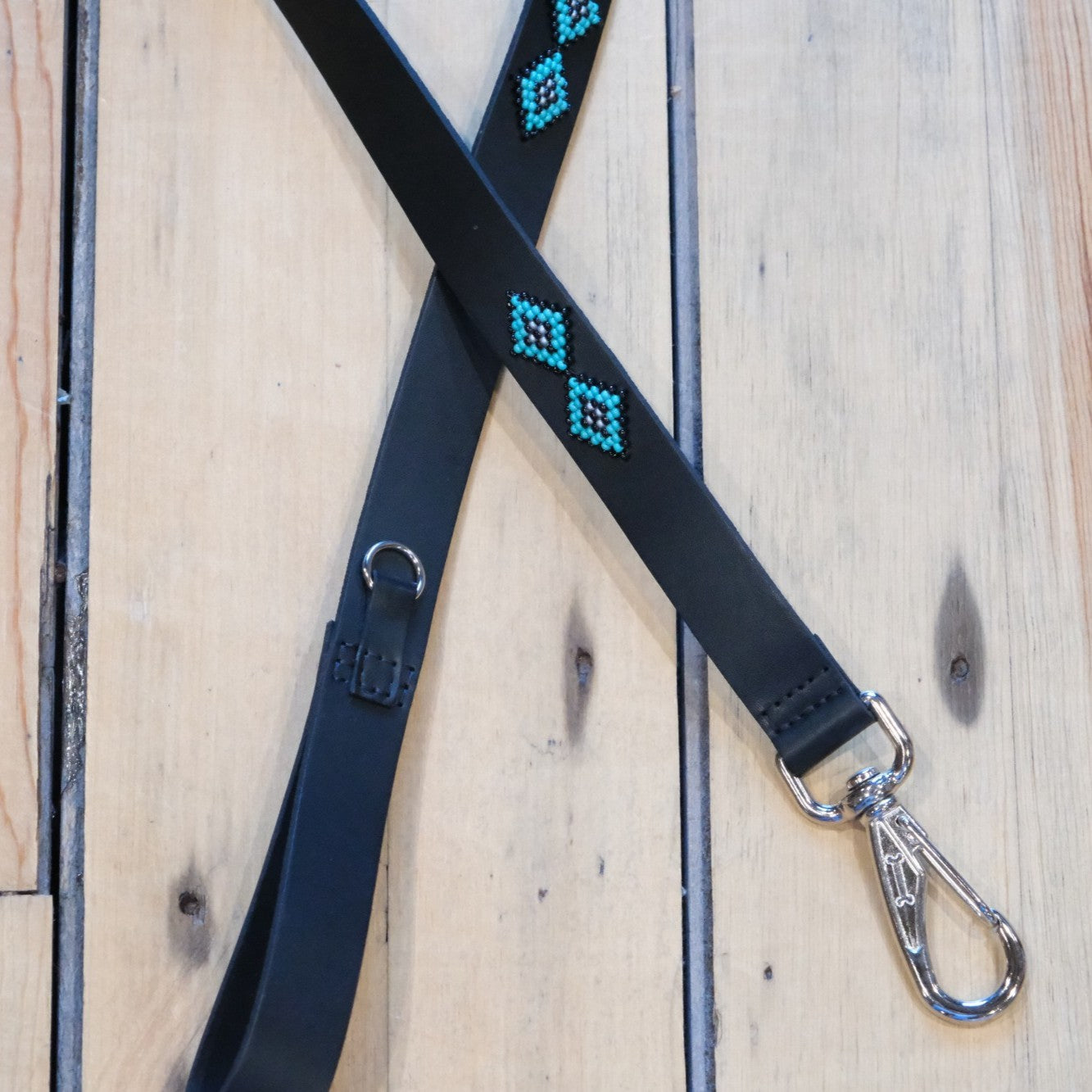Saint Barth Sambboho hand-beaded dog leash in black leather with blue and silver glass beads.