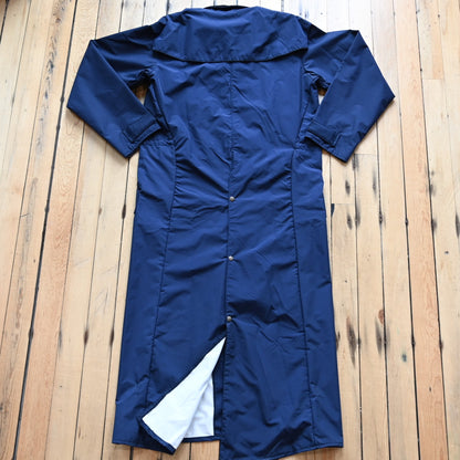 View of Navy waterproof Stockman duster by Schaefer with leather collar and storm flap
