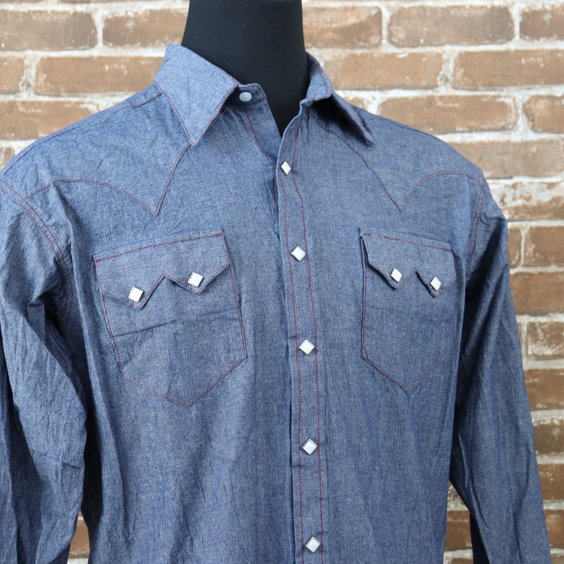 View of Rockmount blue chambray western shirt with sawtooth pockets and diamond snaps