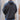 View of Filson Granite Spire Fleece Pullover in Black featuring Cordura® nylon-reinforced forearms and microfleece-lined handwarmer pockets