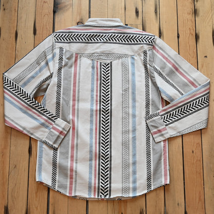 Kimes Ranch Men’s Double Tap Stripe Button-Up Shirt in cream with red, blue, gray, and black vertical stripes
