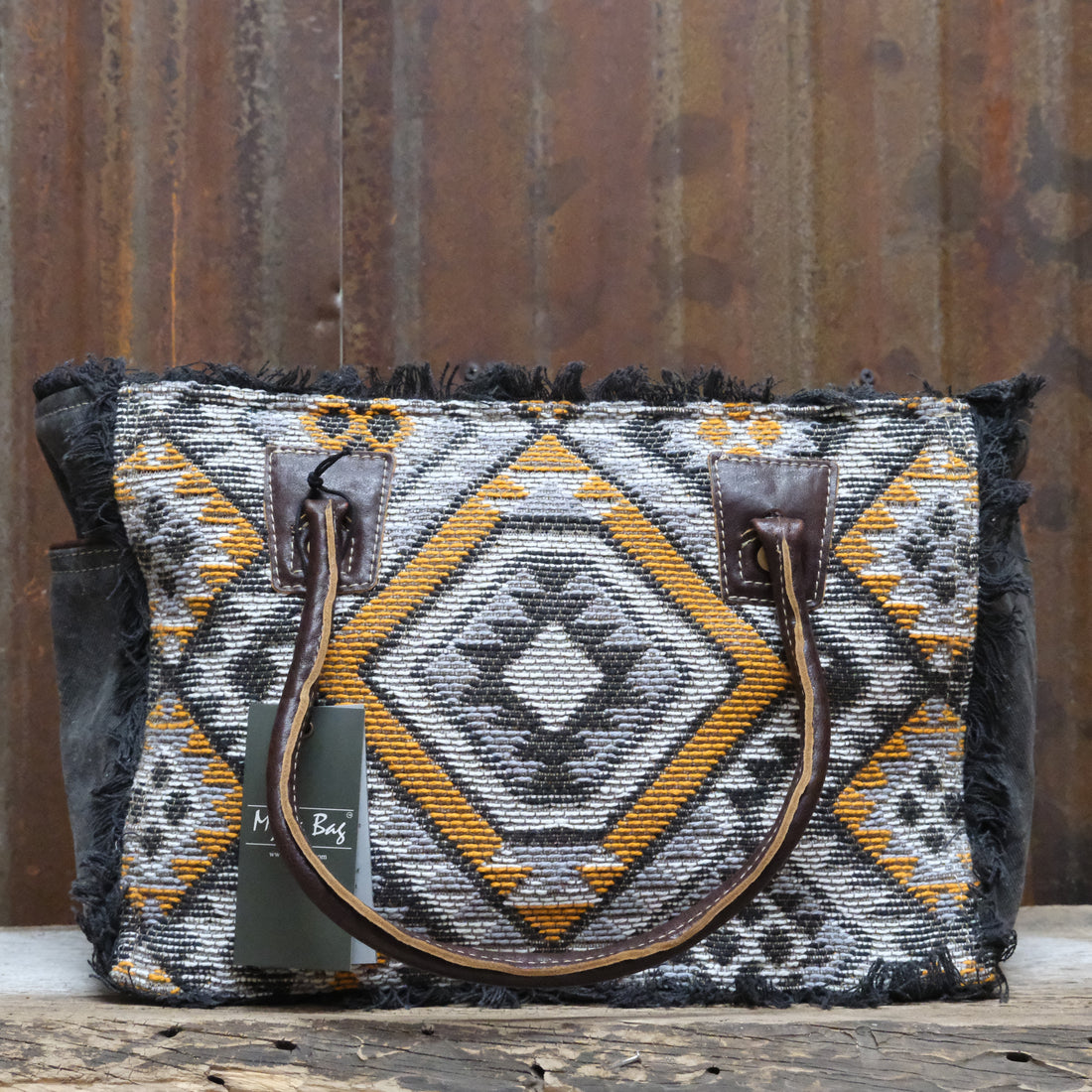 Myra Orange Affairs printed canvas small crossbody bag with leather trim and adjustable strap