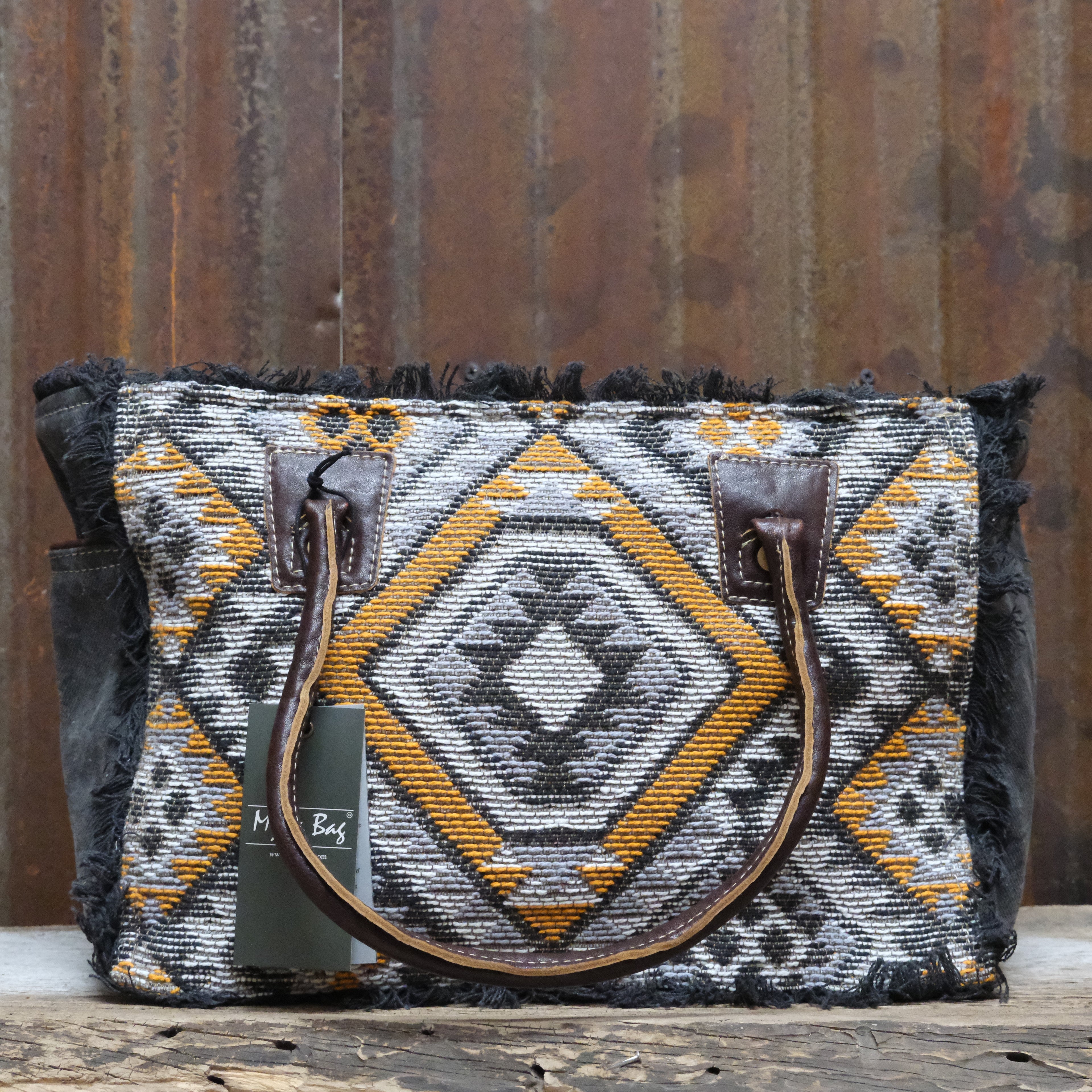 Myra Orange Affairs printed canvas small crossbody bag with leather trim and adjustable strap