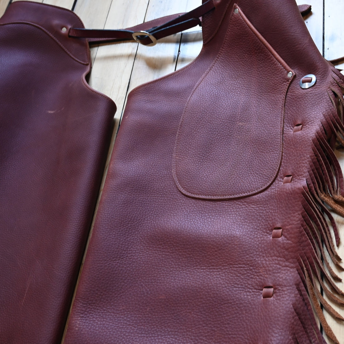 View of K Bar J Cowboy Basic Shotgun Chaps in Size X-Large with fringe and buckle closures