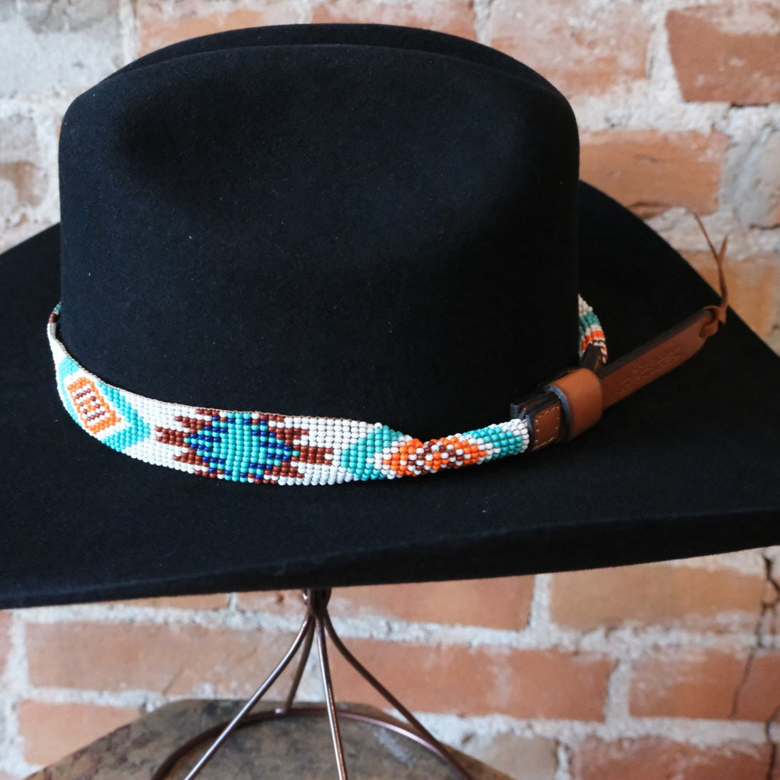 Sambboho Aztec beaded leather hatband with vibrant red, white, and turquoise native geometric patterns.