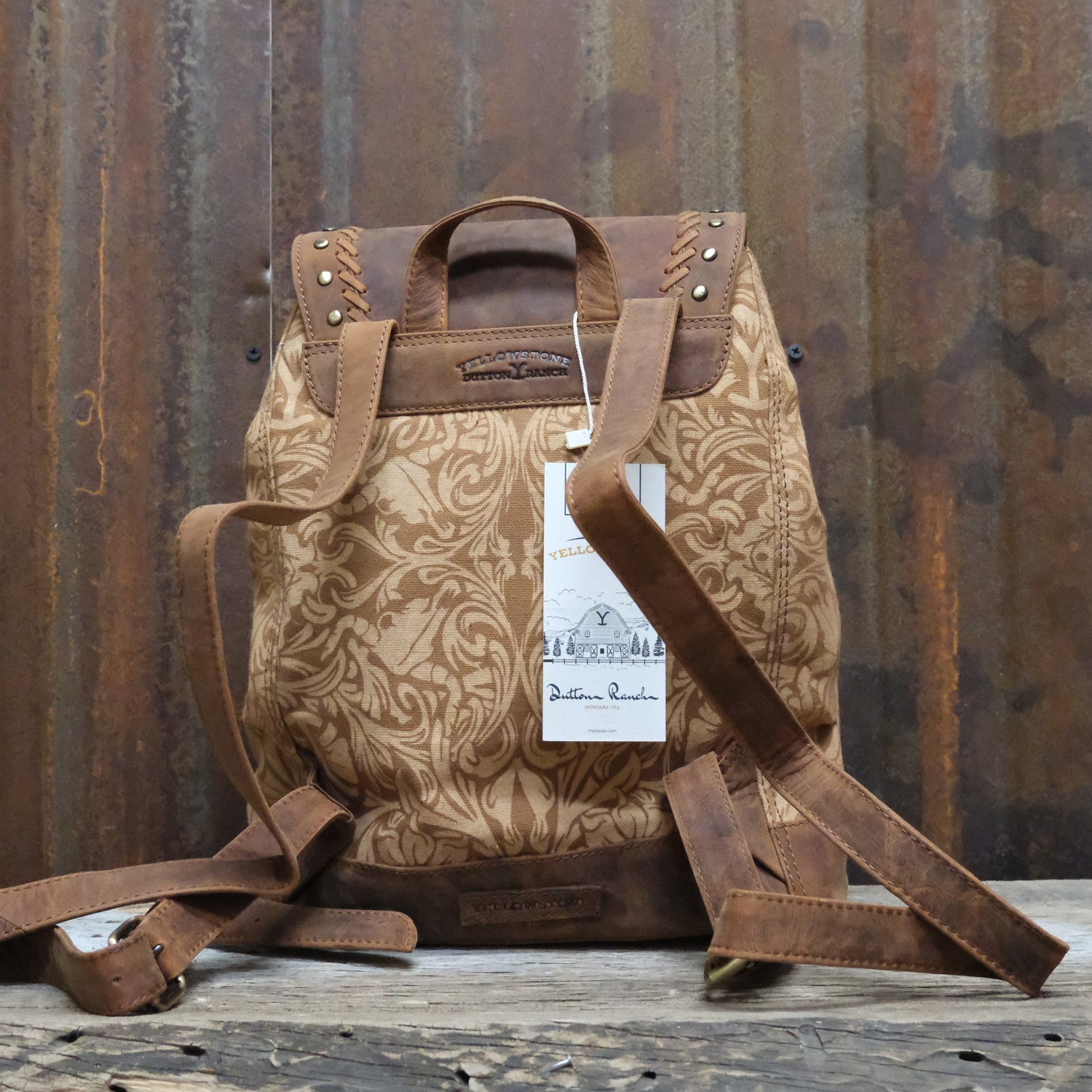 Myra Yellowstone Amber Sienna printed canvas drawstring backpack with leather trim and adjustable straps