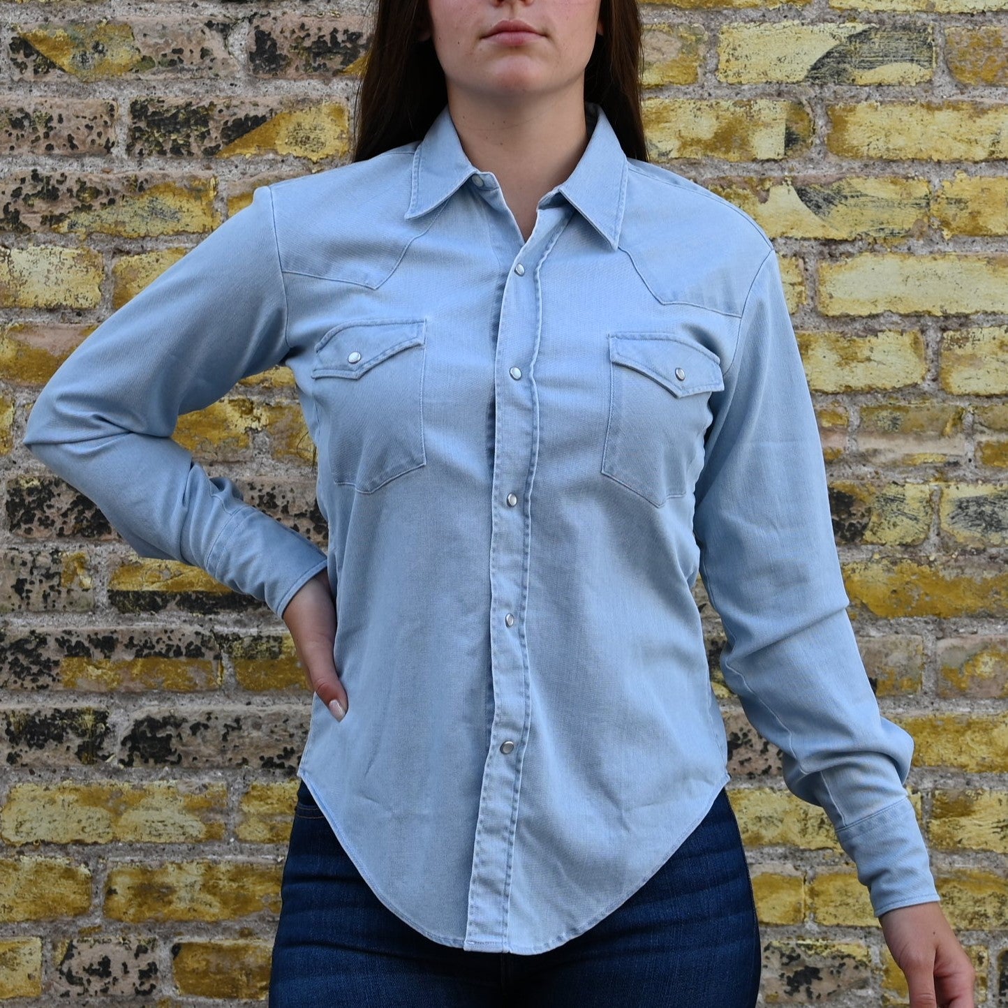 View of Blue Blanket ladies light denim Western shirt with pearl snaps, curved hem, and yoke