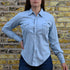 View of Blue Blanket ladies light denim Western shirt with pearl snaps, curved hem, and yoke