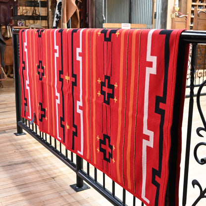View of Red Pendleton robe blanket with geometric jacquard pattern and felt binding