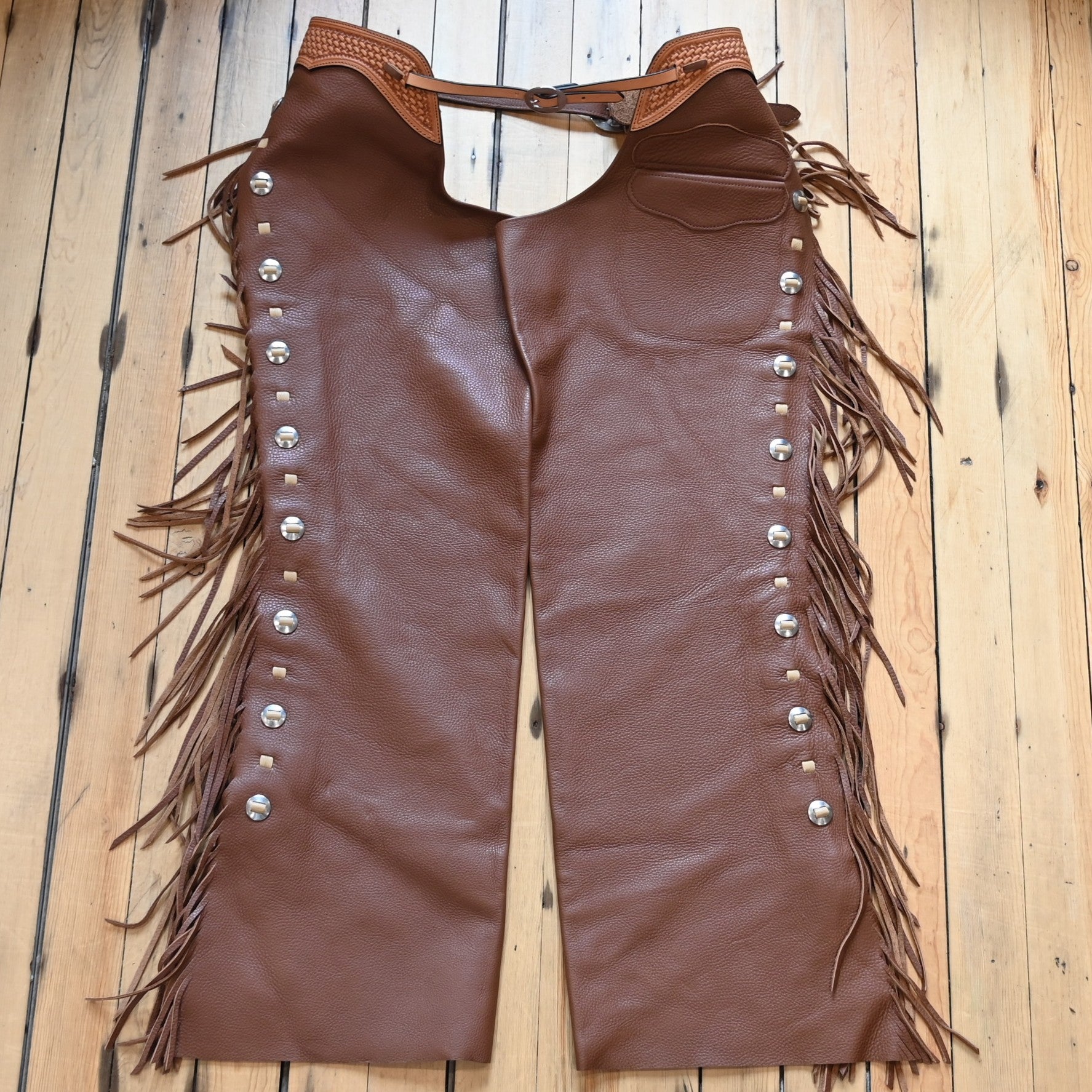 View of K Bar J Puncher Versatility Chap in Size XL with fringe and conchos