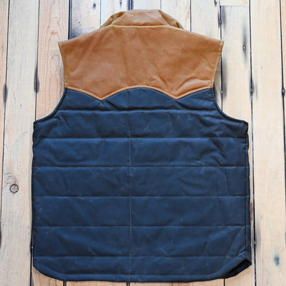 Schaefer Outfitter RangeWax Puffer Vest in waxed cotton canvas with high collar, wool insulation and front utility pockets