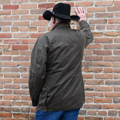 View of Schaefer oak waxed canvas High Plains Drifter jacket with leather collar and multiple pockets