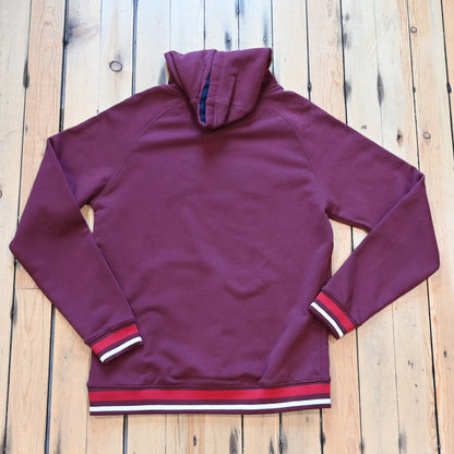 View of Kimes Ranch Kubo Sweatshirt in Burgundy, featuring a vibrant striped bottom and embroidered logo