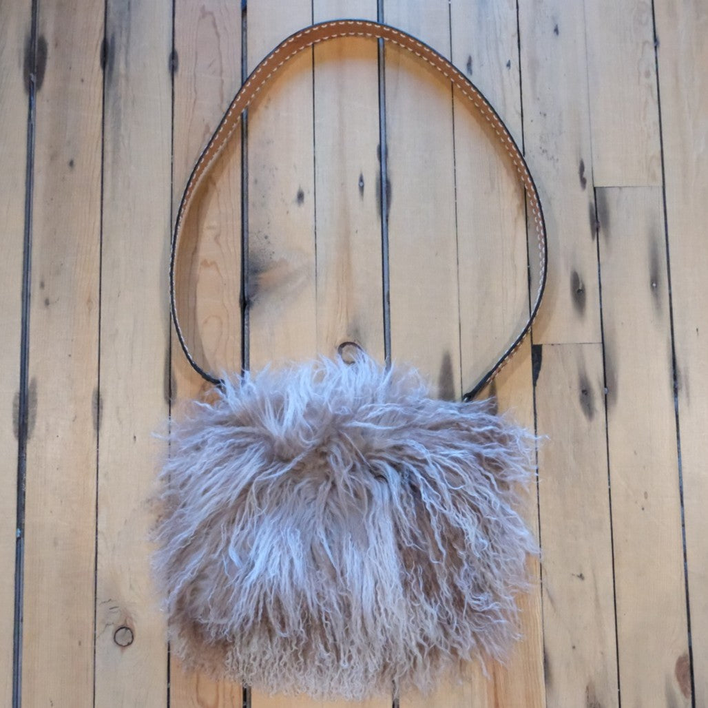 Morris Kaye Beige Snowtop Tibetan Lamb fur muff bag with western tooled leather strap.
