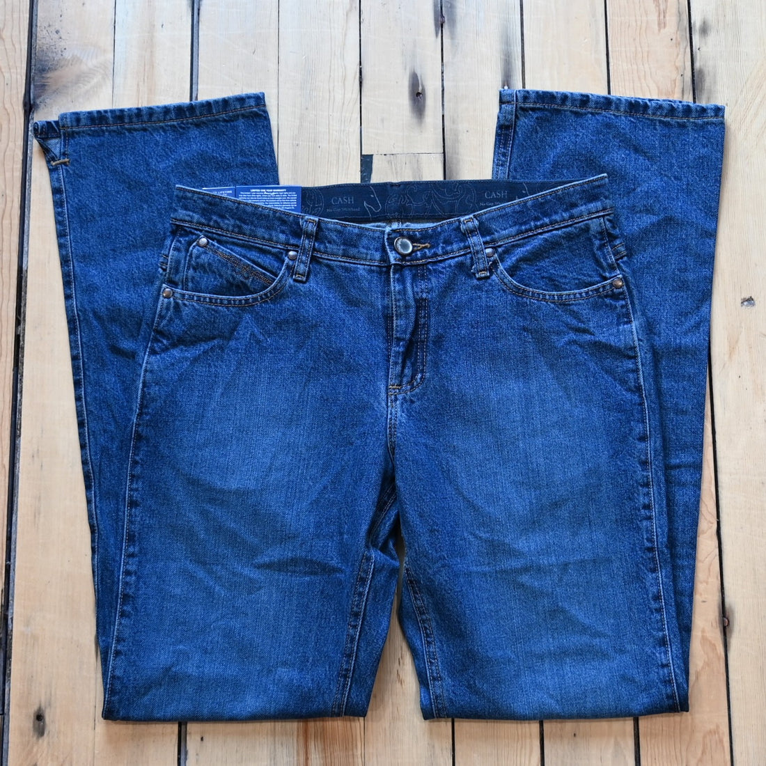 View of Wrangler Ultimate Riding Jean – Cash Fit in American Spirit wash with boot cut leg