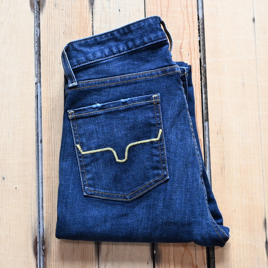 View of Kimes Ranch Sarah Jean in Blue Wash featuring high-rise waist, slim bootcut leg, and Longhorn logo