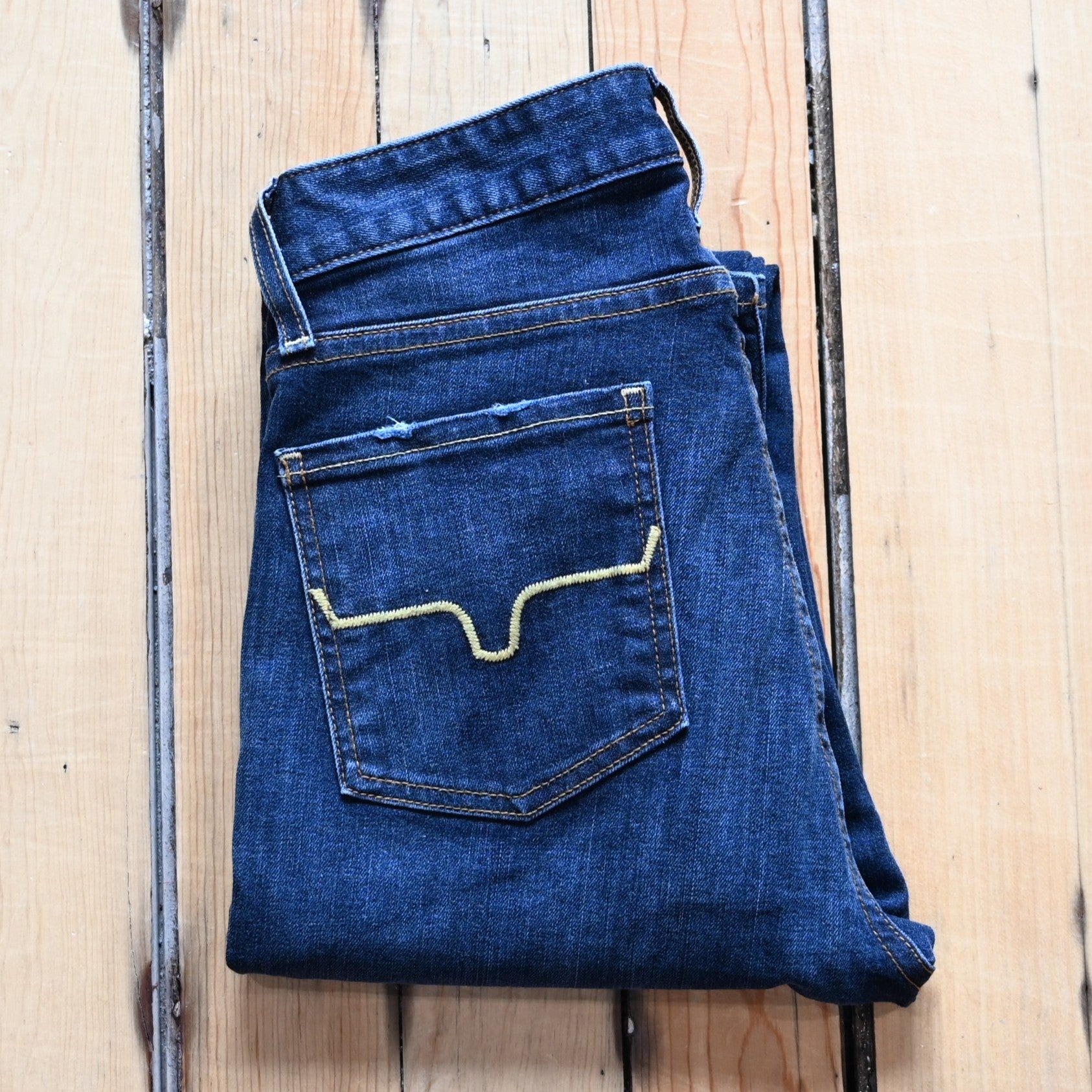 View of Kimes Ranch Sarah Jean in Blue Wash featuring high-rise waist, slim bootcut leg, and Longhorn logo