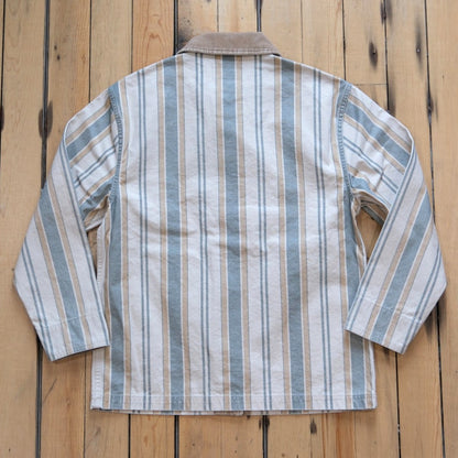 Filson Ladies Canvas Barn Coat in Natural/Yellow featuring a button-front design and large patch pockets.