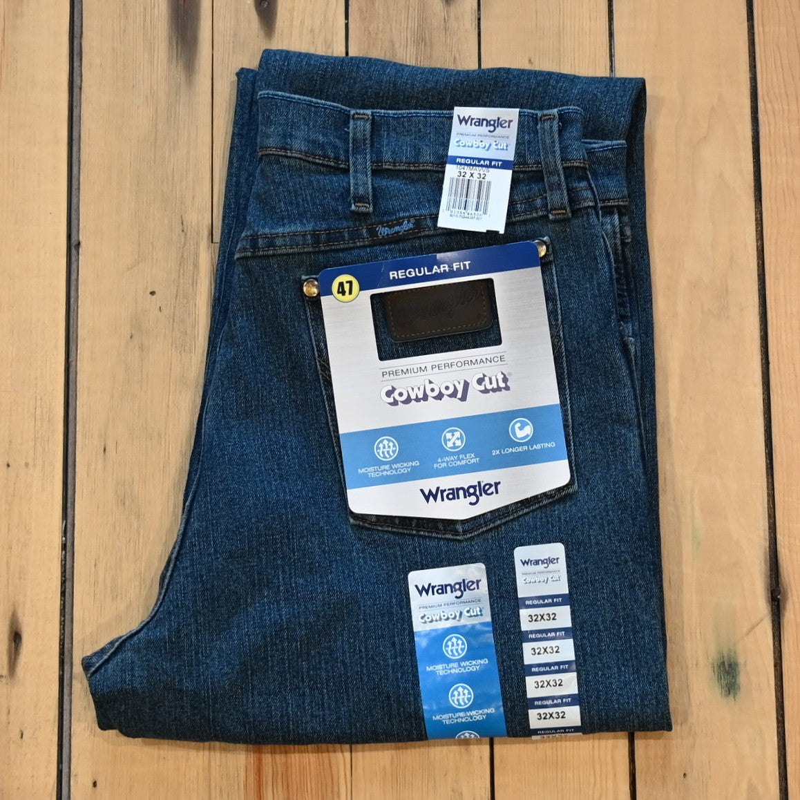 View of Wrangler Men’s Premium Cowboy Cut jeans in Vintage Stone with stretch denim and moisture-wicking comfort