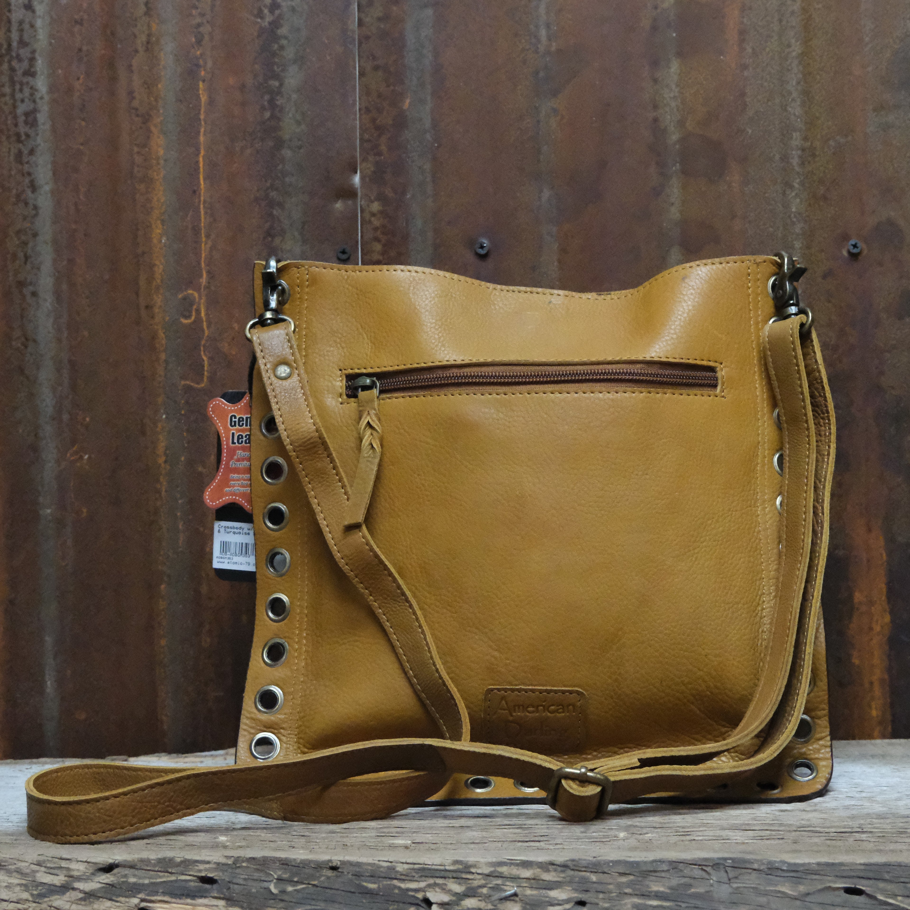 American Darling leather crossbody bag with studded circle and turquoise concho