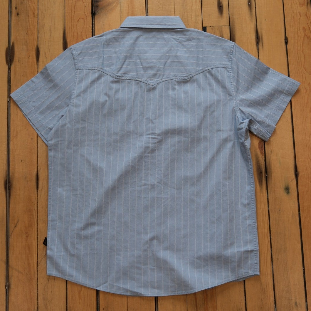 Howler Bros Crosscut Deluxe Shortsleeve Snapshirt in Surfbird: Sky Oxford Dobby.