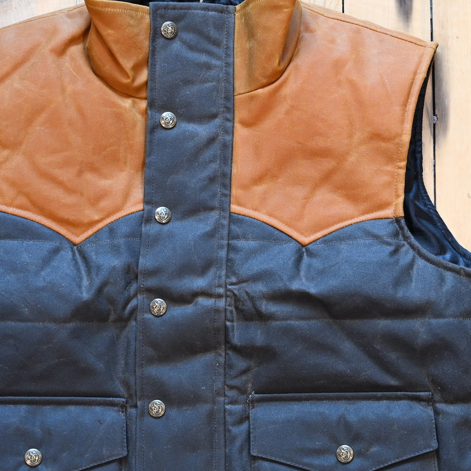 Schaefer Outfitter RangeWax Puffer Vest in waxed cotton canvas with high collar, wool insulation and front utility pockets