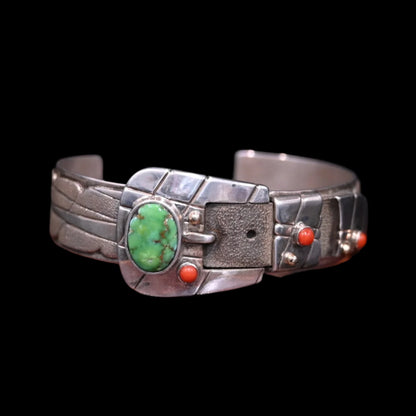 View of Sunwest Silver Carico Lake Turquoise Belt Cuff featuring a belt-like structure with a Carico Lake turquoise stone and spiny oyster stone dots set in sterling silver