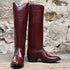 View of Stallion Ladies 16" Burnt Red Calf English High Boot with B toe and covered piping