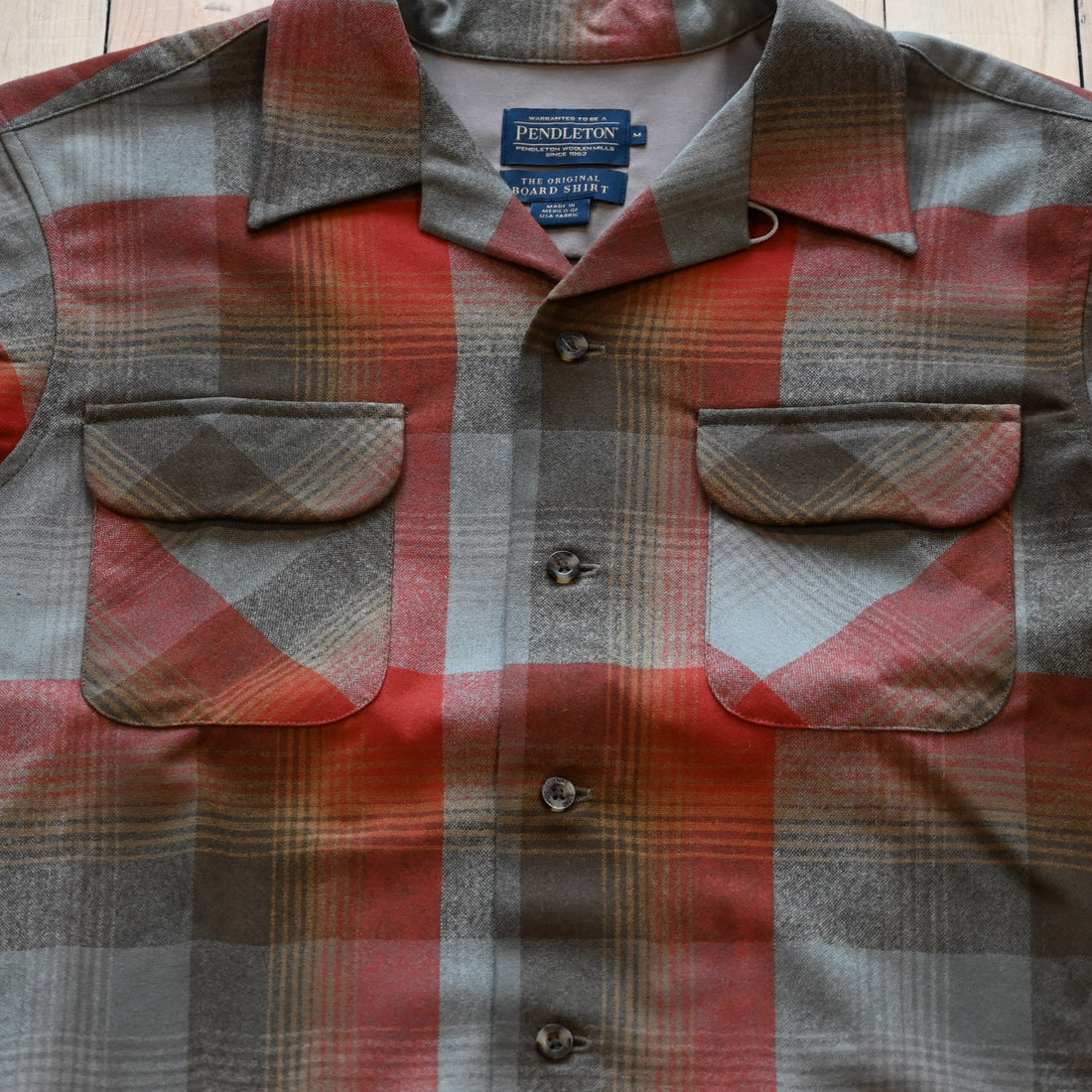 View of Pendleton men’s wool board shirt in tan red plaid with square hem and bias chest pockets