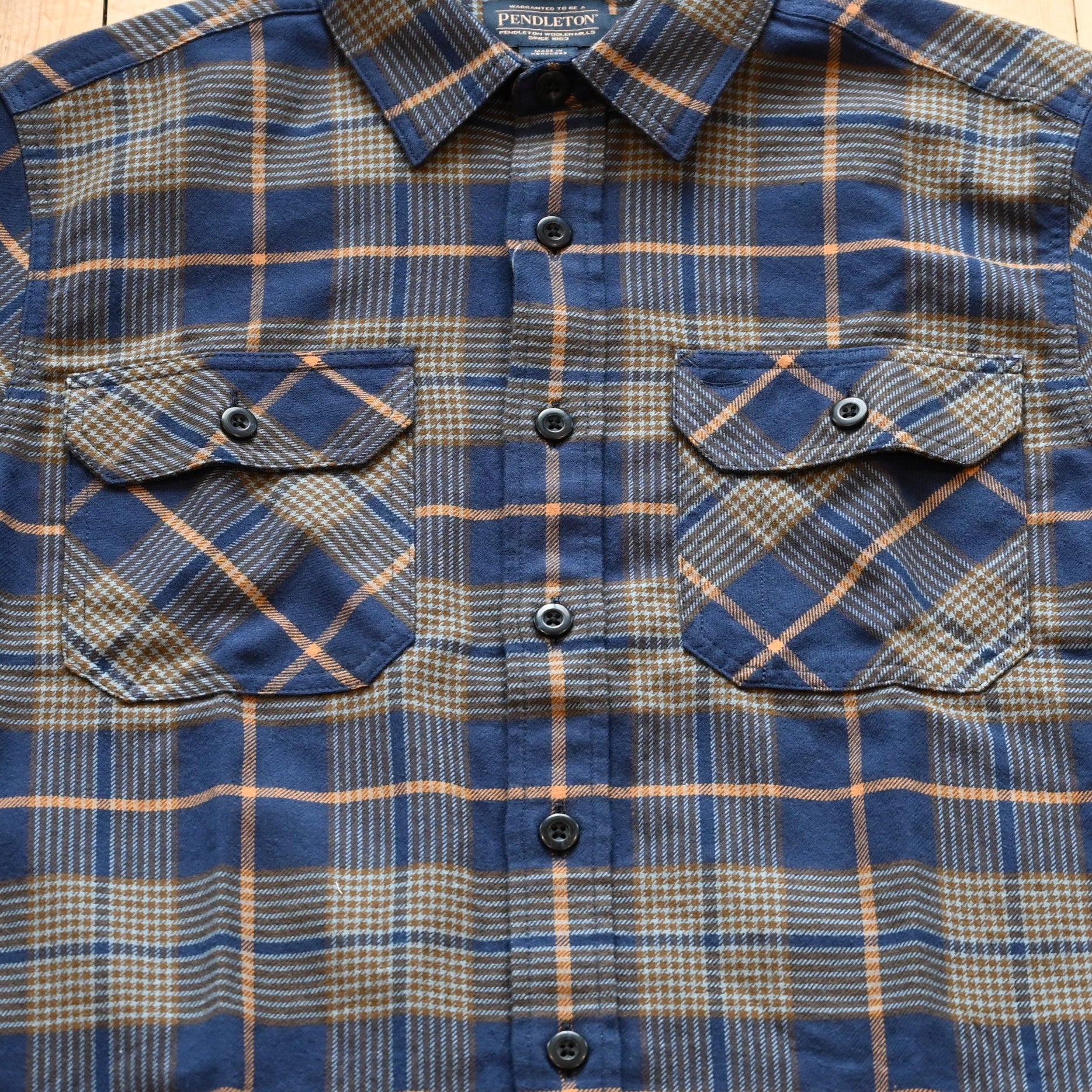 View of Pendleton men’s Burnside flannel shirt in navy and khaki plaid with square hem