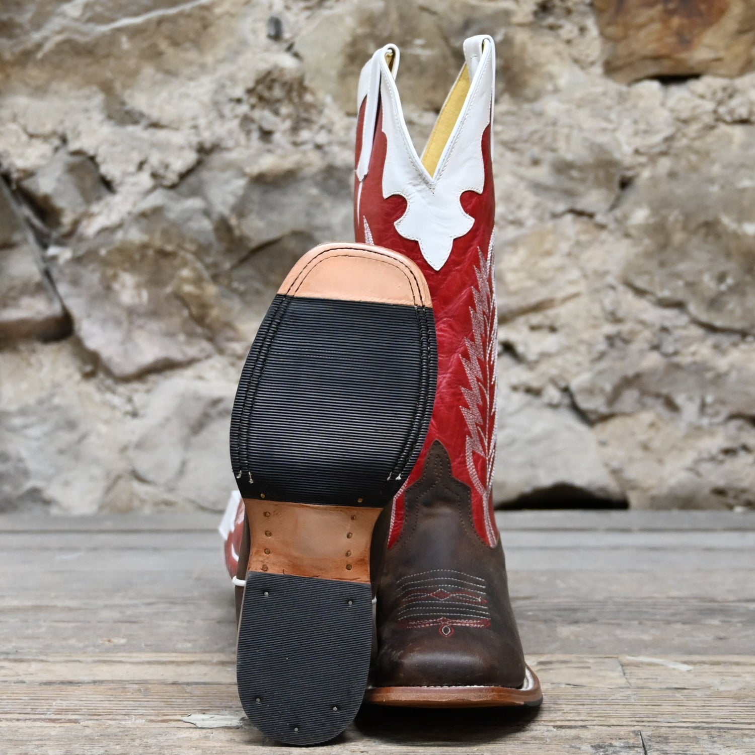 View of Anderson Bean kids boot with red top, saddle mad dog vamp, and pull straps