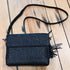 Gun Toten Mamas black embroidered lambskin clutch with rose design and conceal carry features