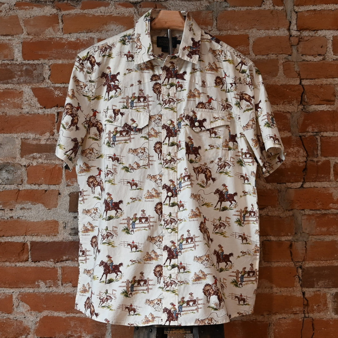 Pendleton men’s Laramie snap-front shirt in Ecru Wild Horses pattern with pearlized snaps and Western yokes