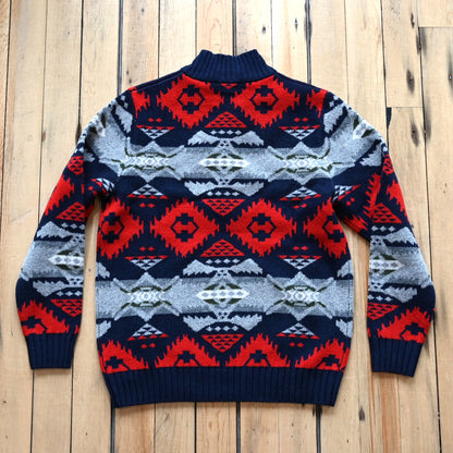 View of Pendleton men’s Nehalem lambswool ¼‑zip sweater in navy and red with geometric pattern