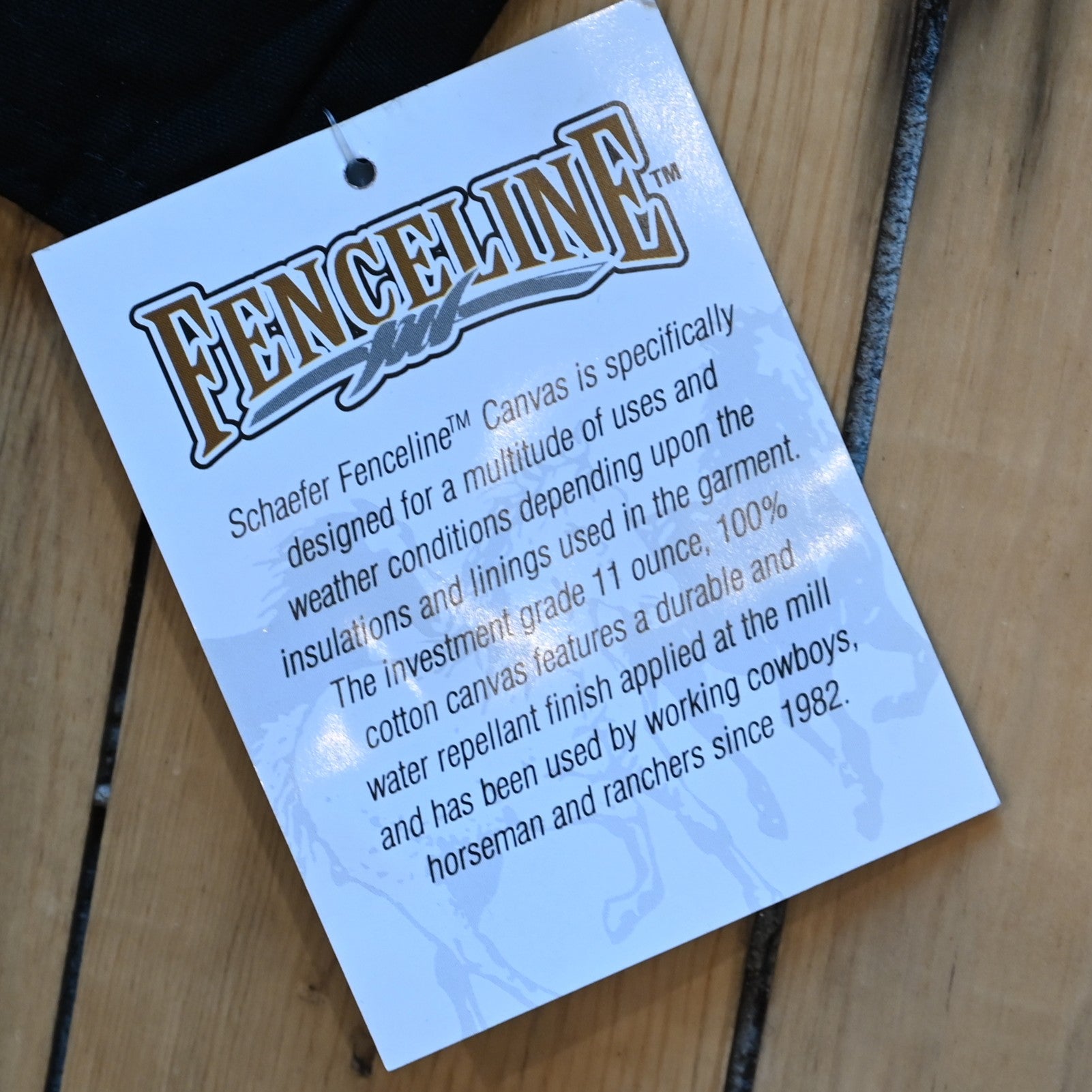 View of Black full-length Schaefer canvas duster coat with utility pockets and corduroy collar