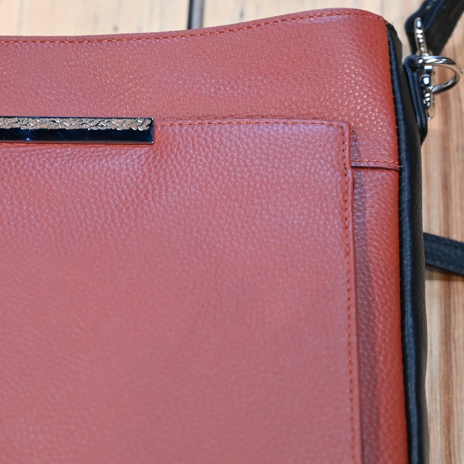 Gun Toten Mamas conceal carry Slim Cross-Body bag in cinnamon leather with black trim