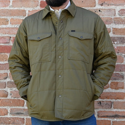 View of Filson Cover Cloth Quilted Jac-Shirt in Olive Drab and Cinder featuring snap-front closure, snap-flap chest pockets, and flannel-lined hand pockets