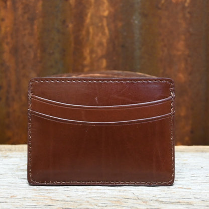 View of Lucchese sienna brown leather credit card case with sleek flat design and embossed logo