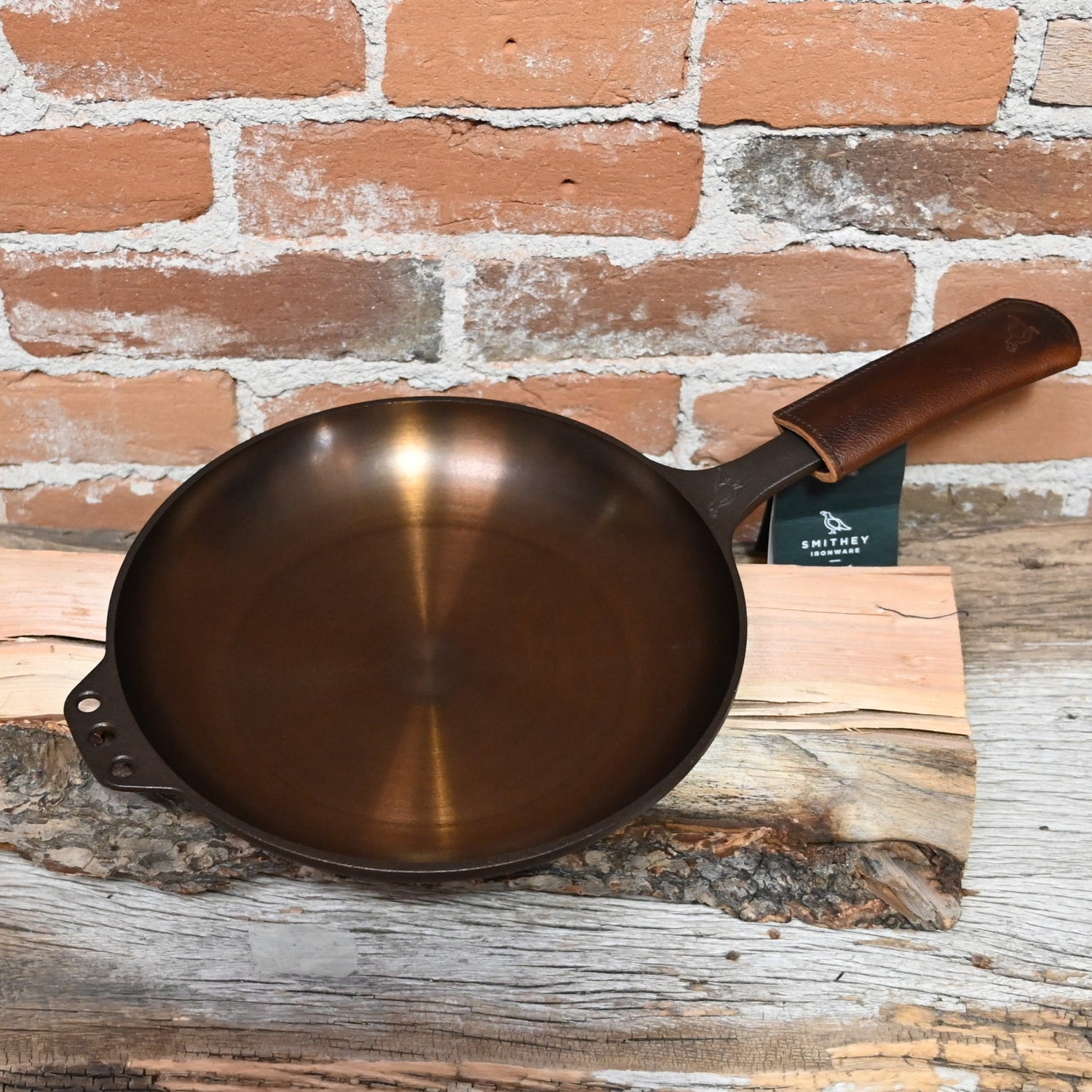 View of Smithey Ironware No. 10 Cast Iron Chef Skillet with polished interior and ergonomic handle