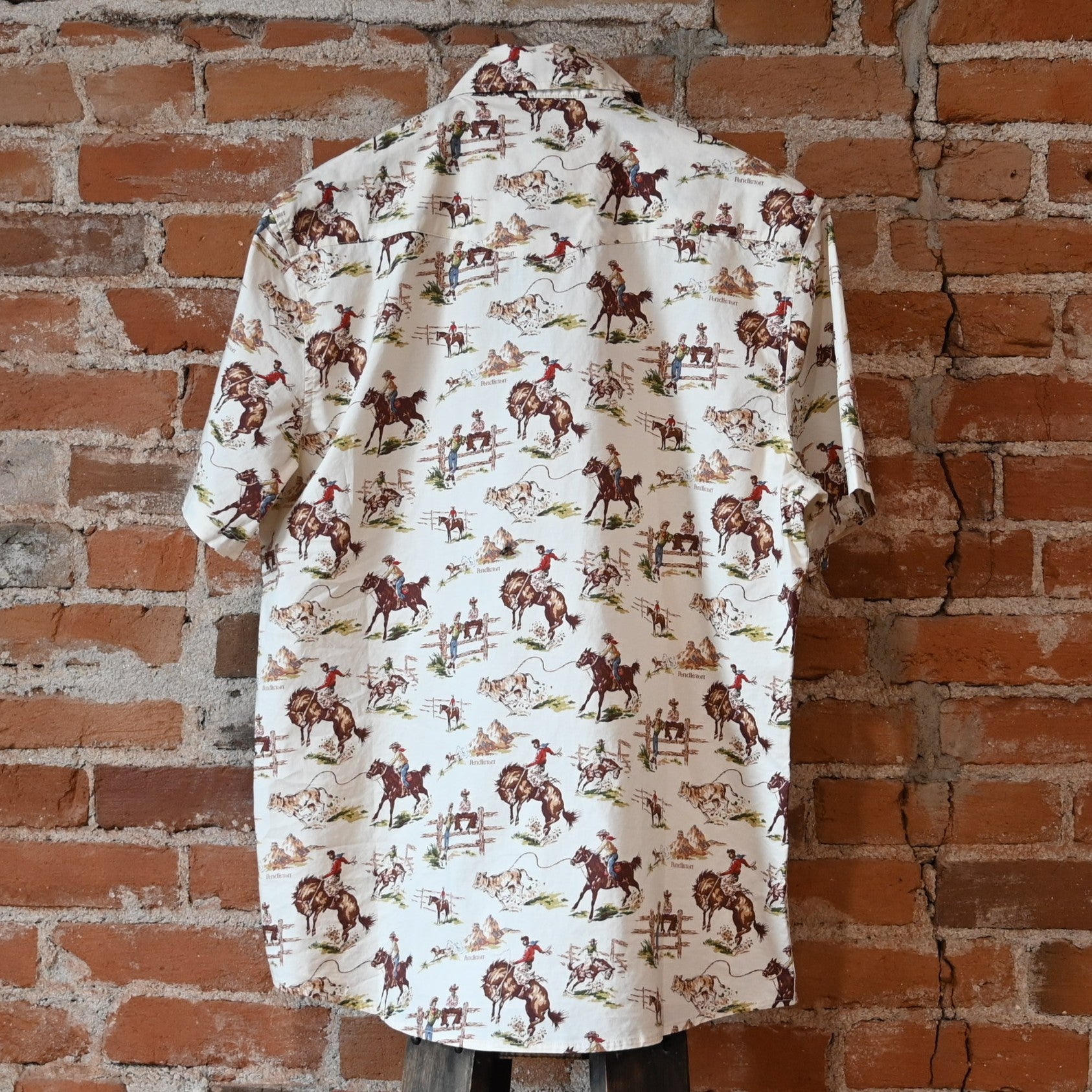 Pendleton men’s Laramie snap-front shirt in Ecru Wild Horses pattern with pearlized snaps and Western yokes